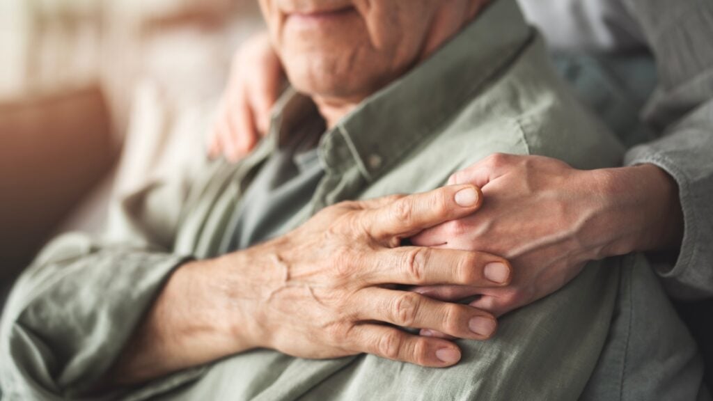 older couple holding hands